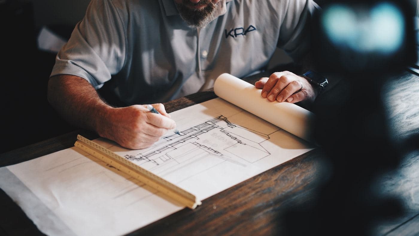 Inspector reviewing measurements and drawings before issuing a quote