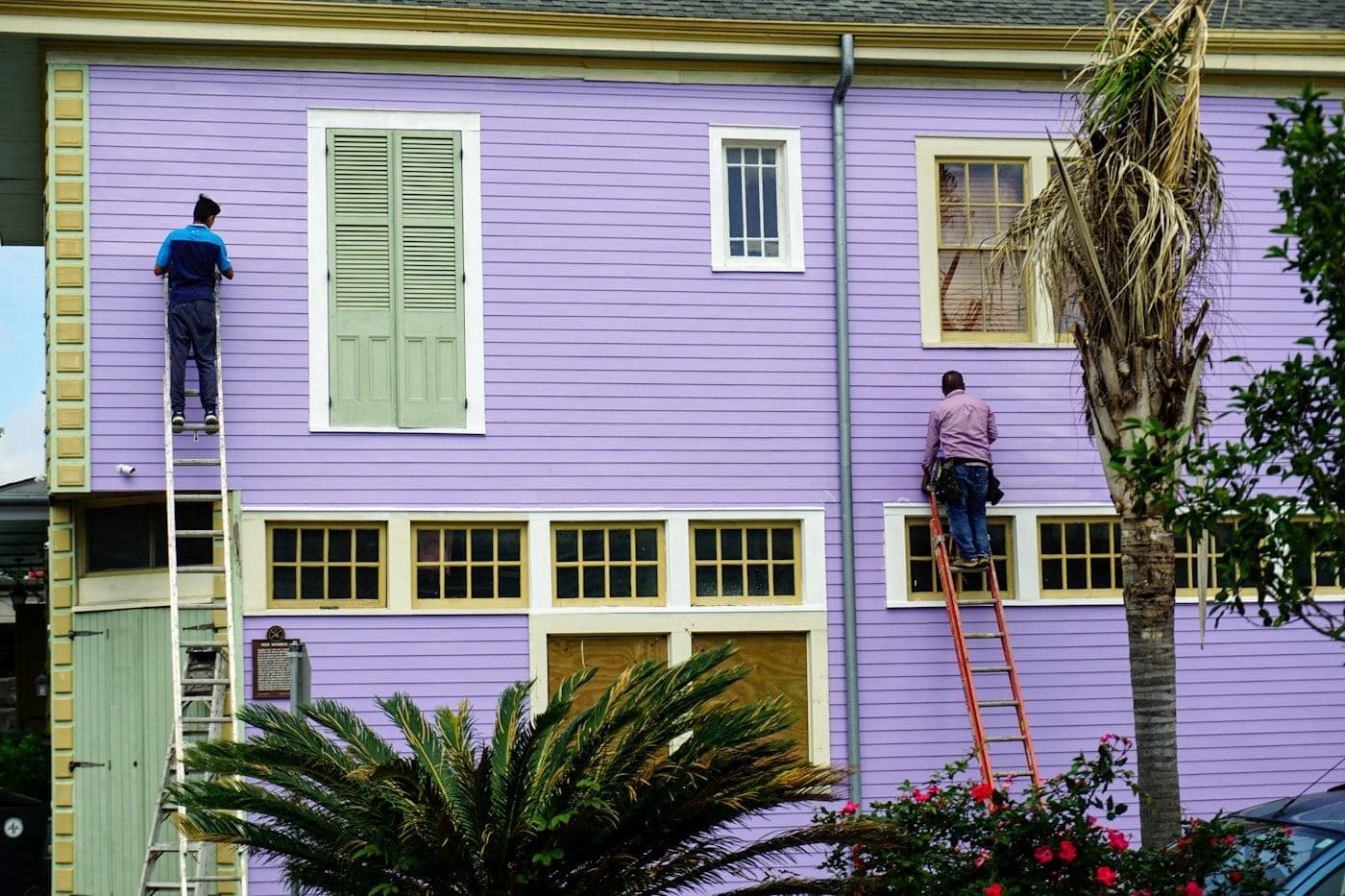 Painters working on the exterior of a house